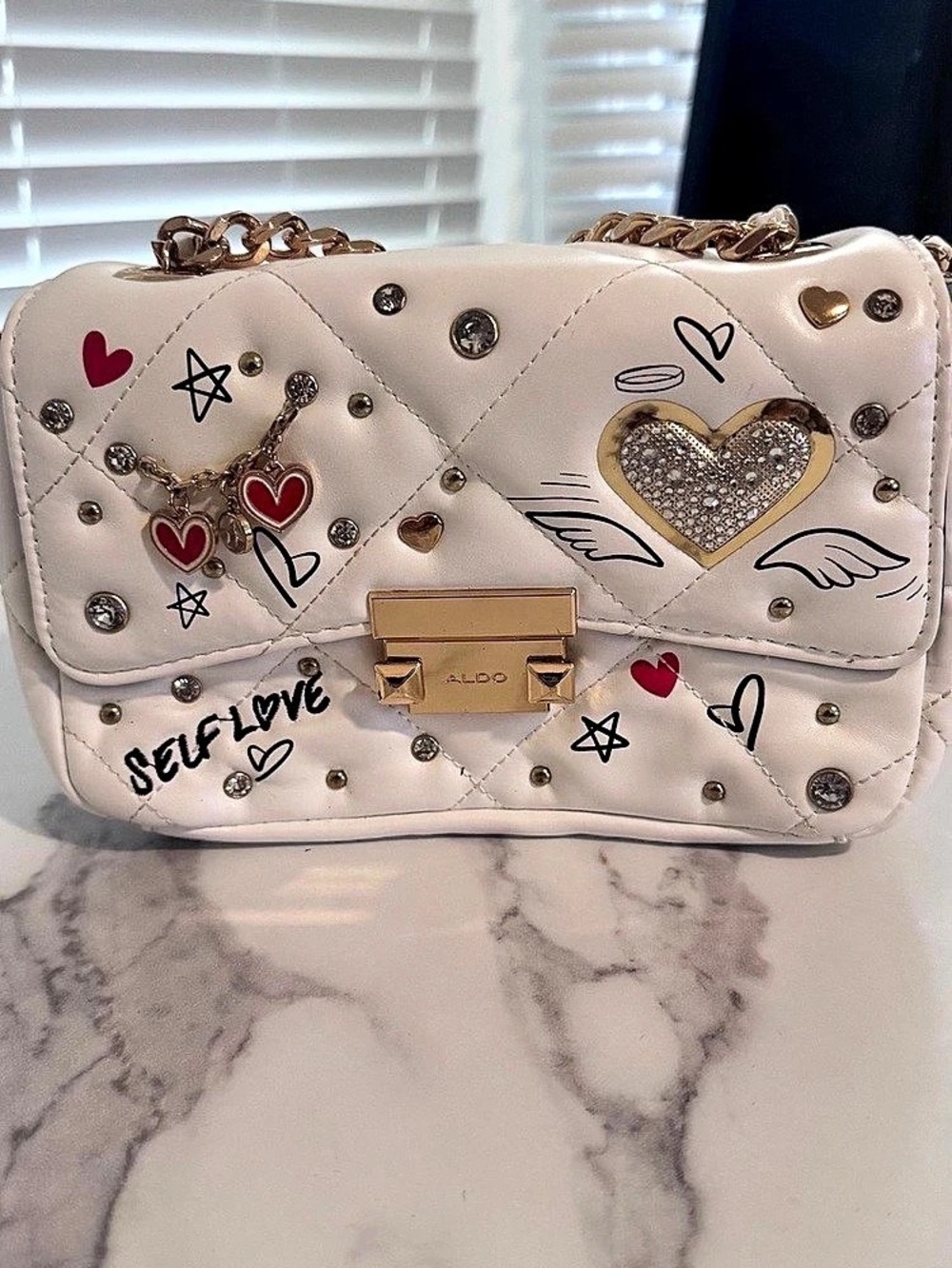 ALDO White Quilted “Self Love” Crossbody Bag